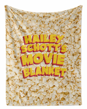 A blanket with the text "Haley Schott's Movie Blanket" printed on it, which appears to be a collage of images related to the movie "Haley Schott's Movie Blanket".