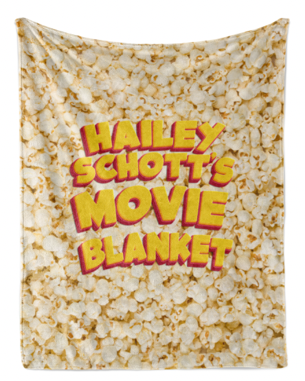 A blanket with the text "Haley Schott's Movie Blanket" printed on it, which appears to be a collage of images related to the movie "Haley Schott's Movie Blanket".