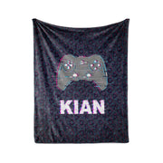 A black and purple patterned blanket with a Nintendo Wii controller design and the name "KIAN" printed on it.