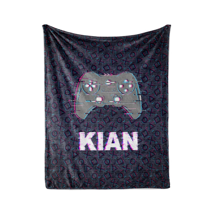 A black and purple patterned blanket with a Nintendo Wii controller design and the name "KIAN" printed on it.