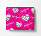 The image is a pink blanket with a repeating pattern of volleyball hearts and the name "Joycelinette" written on it.