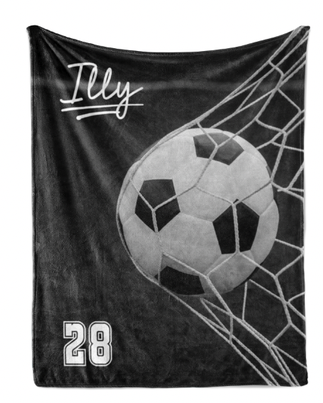 A black and white image of a soccer ball in the net of a soccer goal, with the name "Illy" written above it.