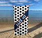 a towel with a name on it on a beach