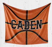 A basketball-themed blanket with the name "Caden" printed on it.