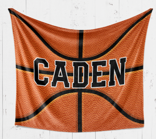 A basketball-themed blanket with the name "Caden" printed on it.