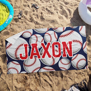 a towel with a name and baseballs on it