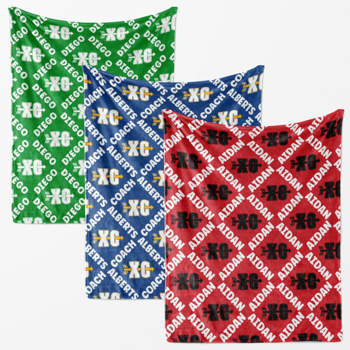 three fabric items with a repeating pattern of the letters 'XC' in different colors: green, blue, and red.