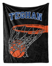 A black basketball net with an orange basketball in the center, along with the name "TEGHAN" written above it.