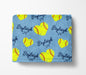 A blue blanket with yellow softball-shaped hearts and the name "Bryleigh" printed on it.