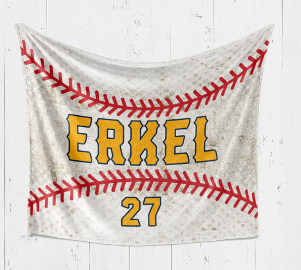 A baseball-themed blanket with the name "ERKEL" and the number "27" printed on it, along with a red and white baseball design.