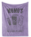 The image is a purple blanket with a graphic design that says "Momo's Movie Watching Blanket" and includes illustrations of popcorn, a soda cup, and a movie ticket.