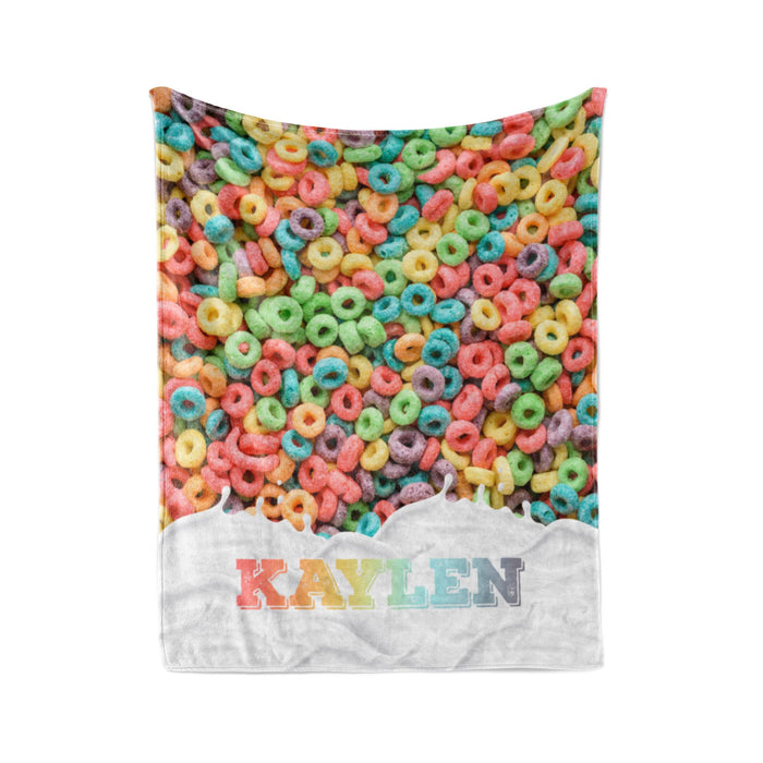 A colorful image of a pile of multicolored cereal loops, with the name "Kaylen" written on a white background.