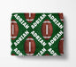 a green blanket with a repeating pattern of red footballs and the name "ADRIAN" written in white.
