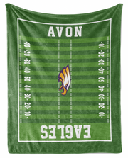 a green football field with the word "AVON" printed on it.