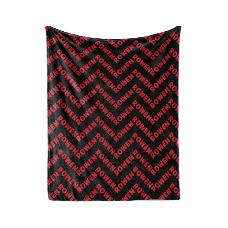 a black and red chevron pattern with the word "ROWEN" repeated across it.