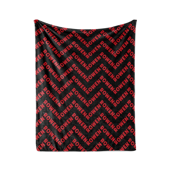 a black and red chevron pattern with the word "ROWEN" repeated across it.