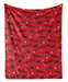 a red blanket with a repeating pattern of hockey sticks and puck silhouettes.