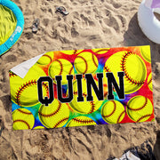 a beach towel with a picture of baseballs on it