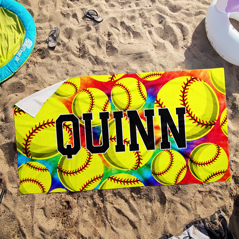 a beach towel with a picture of baseballs on it