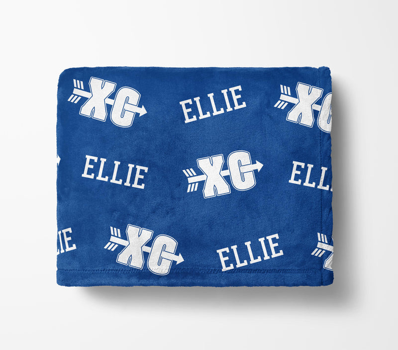 The image is a blue blanket with white text and arrows printed on it.