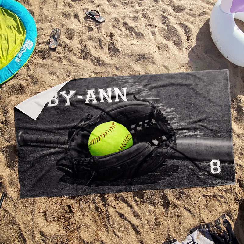 a towel with a picture of a baseball and glove on it