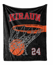 A black basketball jersey with the name "KIRAUN" and the number "24" printed on it, along with an illustration of a basketball going through the hoop.